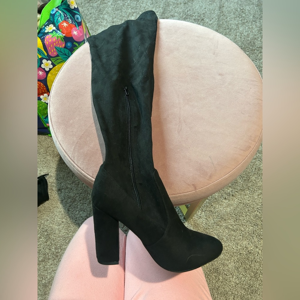 Knee high black heeled boots
